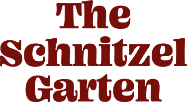 shnitzel-garten-logo-stacked Red text logo for "the schnitzel garten" featuring a playful, serif font style.